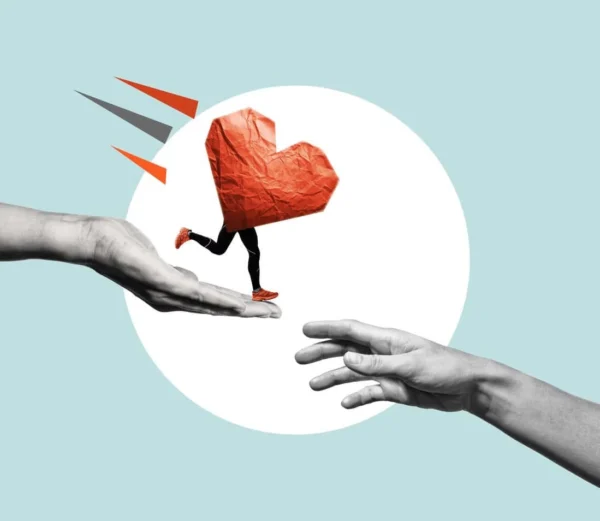 “Conceptual image of a red paper heart with legs running from one open hand to another, symbolizing the act of giving and receiving. Represents the mutual benefits of businesses supporting nonprofit organizations—doing good while growing brand loyalty and customer engagement.”