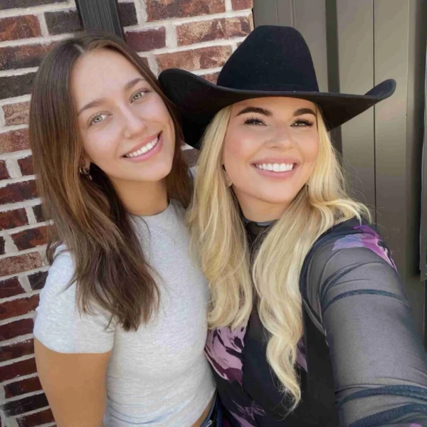 Friendly women smiling outdoors for social media marketing.